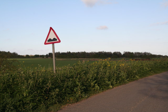 Bumps in road ahead road sign